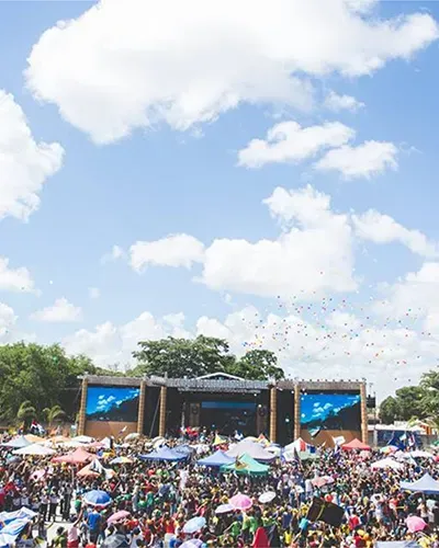 Crowd with hands raised at a Red Devil Events day party